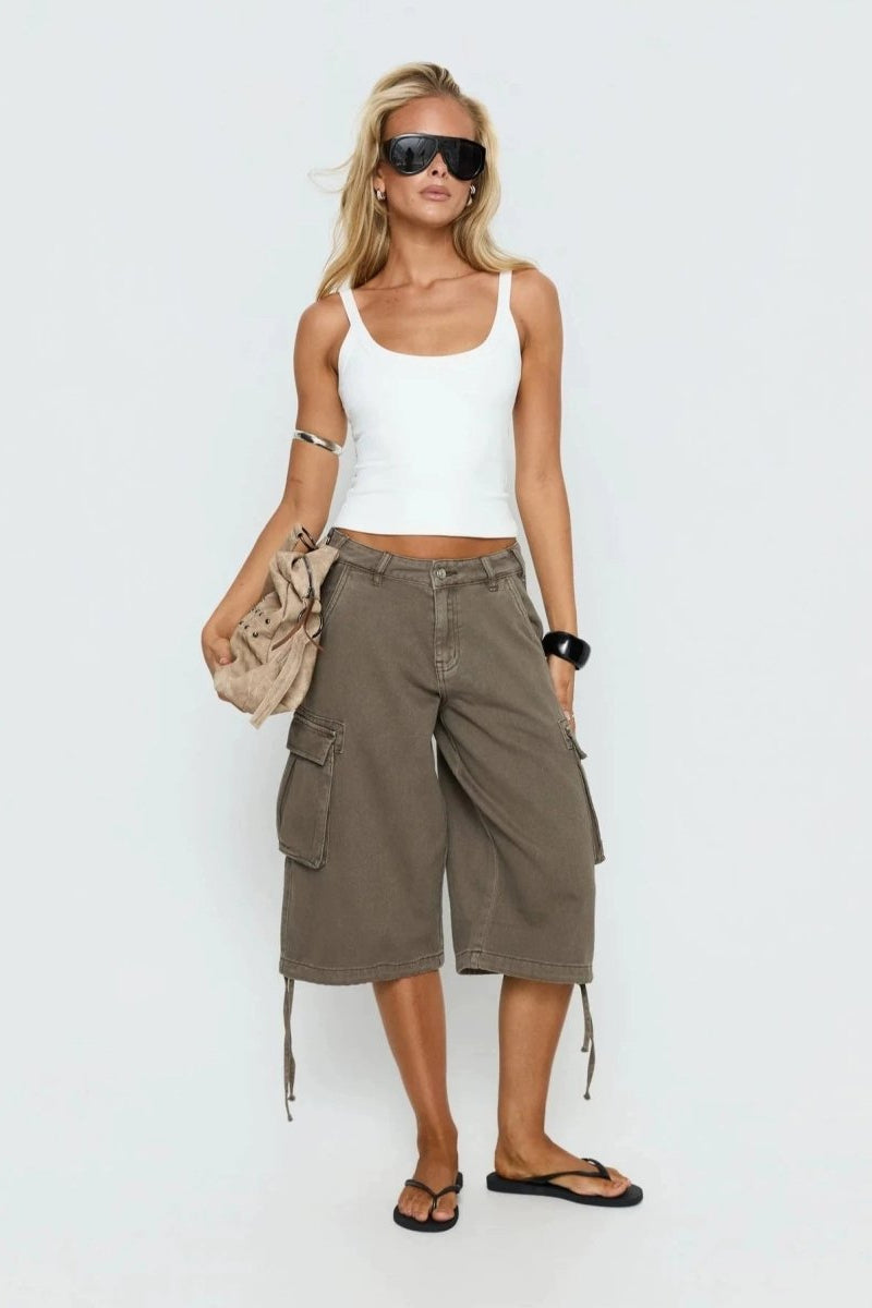 Detail view of women's mocha cargo capris, showcasing pockets and a comfortable, relaxed fit.