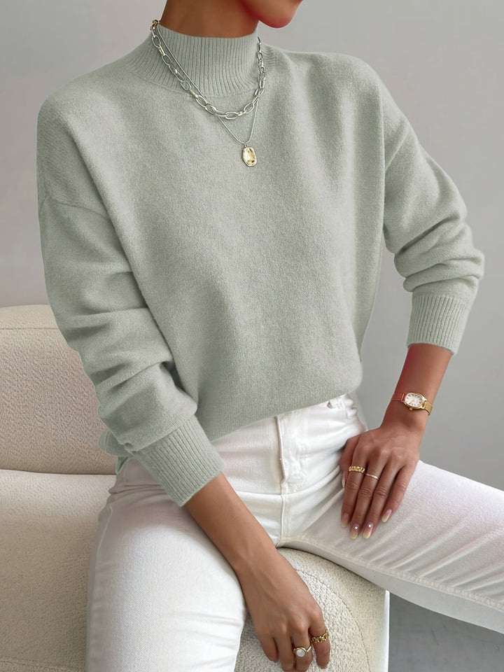 Women's relaxed fit mock turtleneck sweater, long sleeve. Cozy fall & winter pullover for casual comfort.