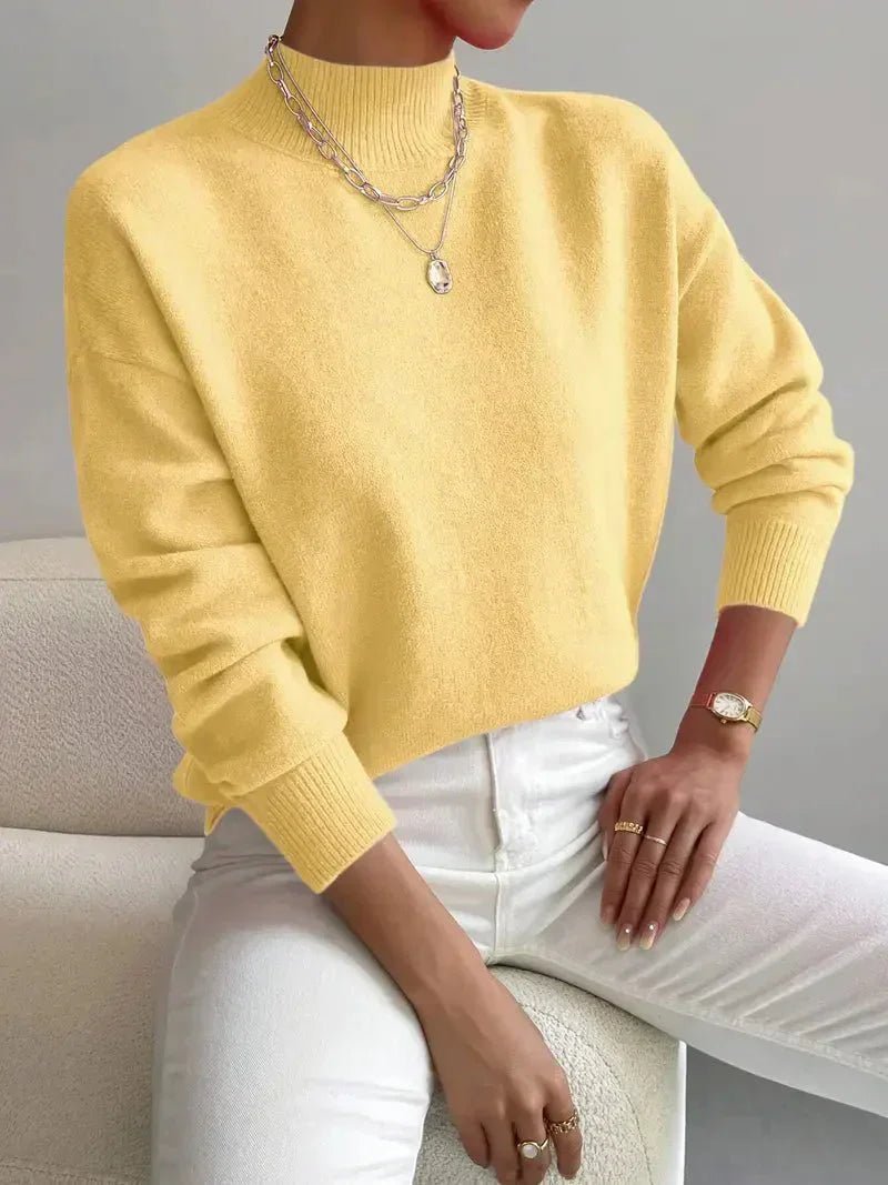 Versatile women's relaxed fit mock turtleneck long sleeve pullover. Great for casual outfits or office wear.
