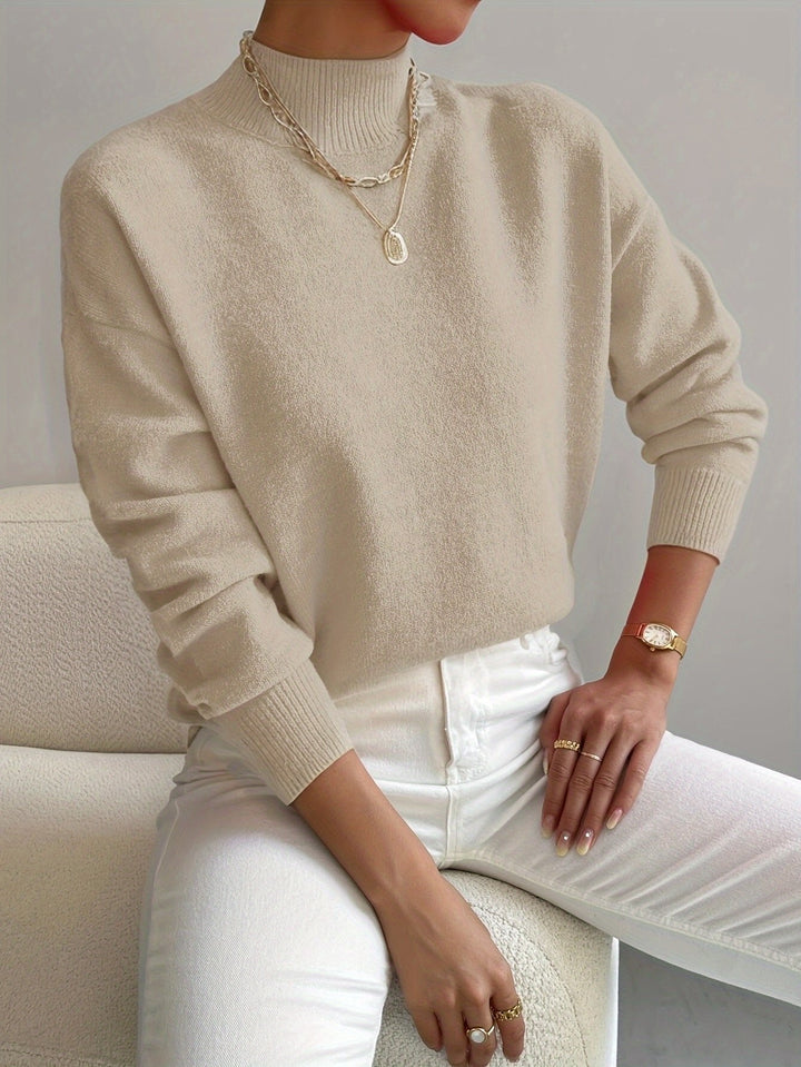 Soft women's relaxed fit mock turtleneck sweater with long sleeves. Comfortable pullover for fall & winter fashion.