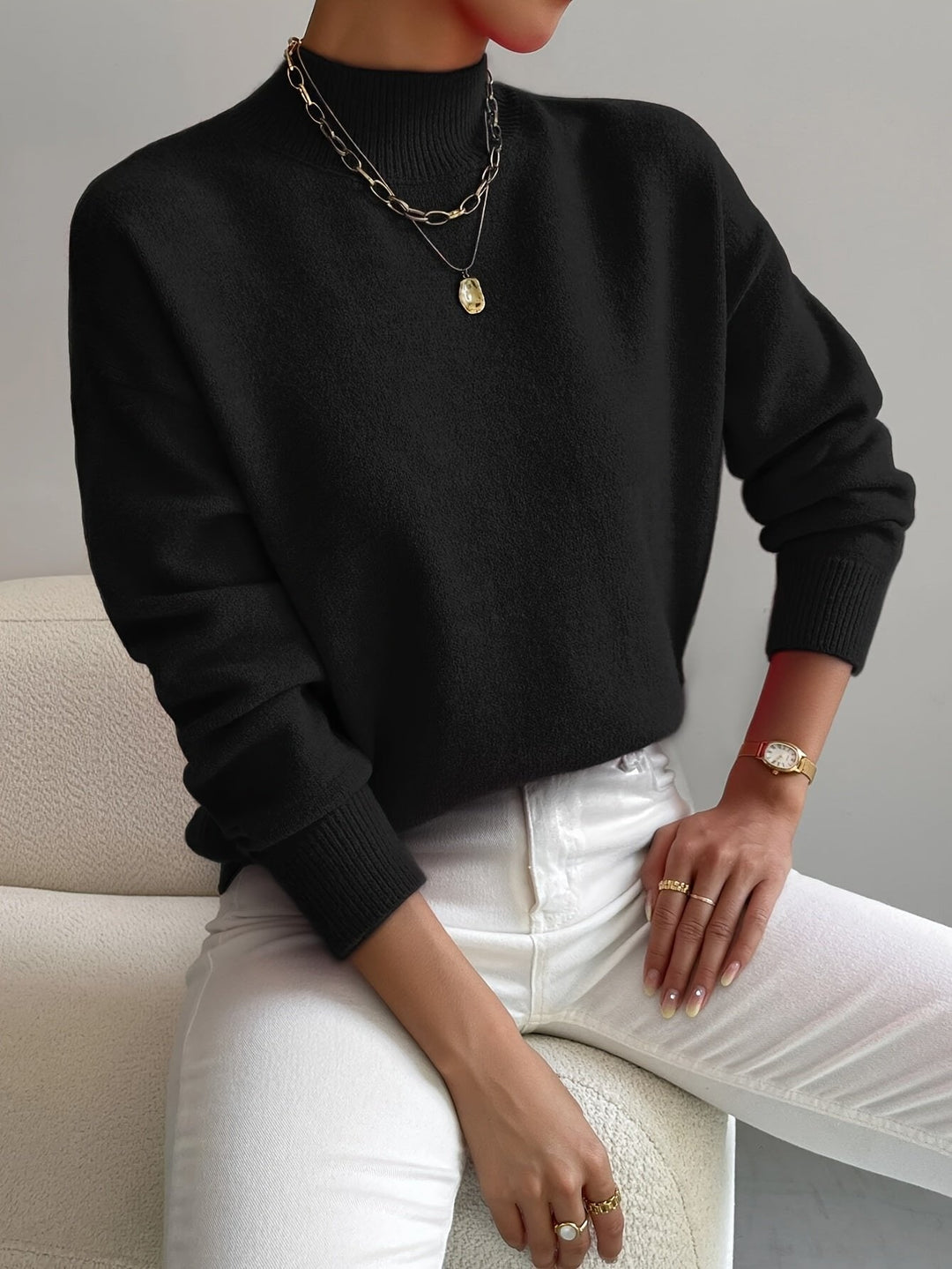 Modern women's relaxed fit mock turtleneck long sleeve sweater. Stylish and comfortable for everyday casual wear.