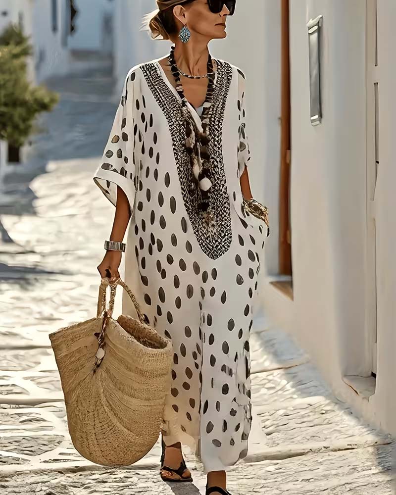 Women's chic polka dot maxi kaftan dress with a relaxed fit, great for vacation & stylish summer look.