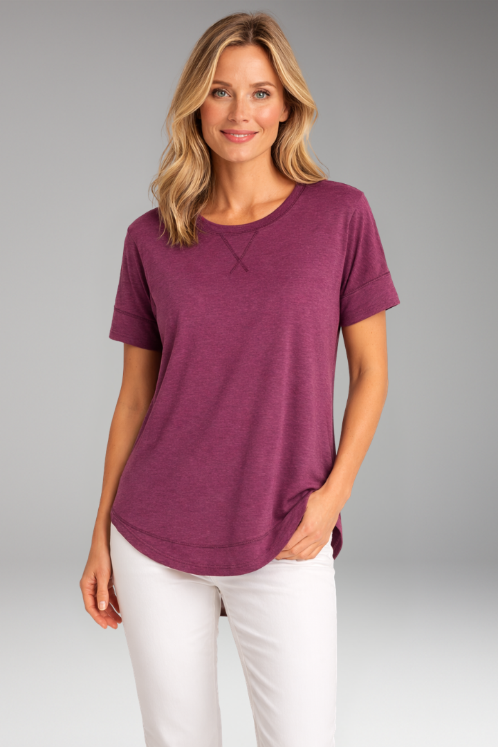 Stylish women's relaxed fit t-shirt on hanger, featuring a comfortable round neck and curved hem.