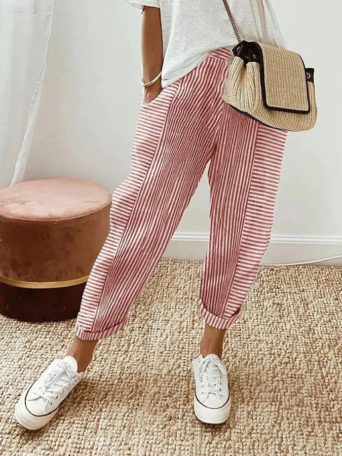 Close-up of the drawstring waist and soft fabric on women's striped relaxed fit trousers, ideal for loungewear.