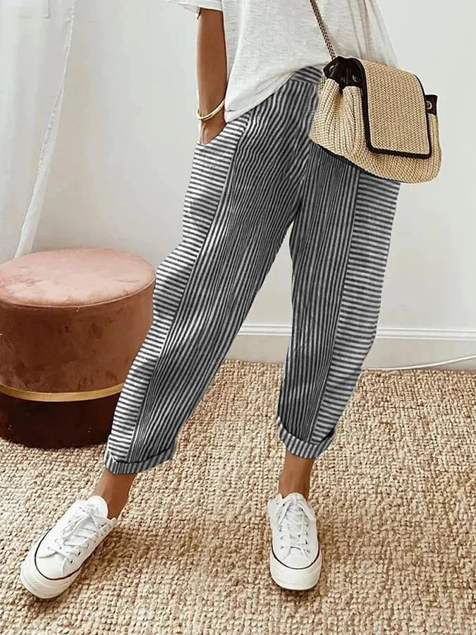 Detailed view of the chic stripe pattern on women's relaxed fit trousers. Perfect for stylish spring fashion.
