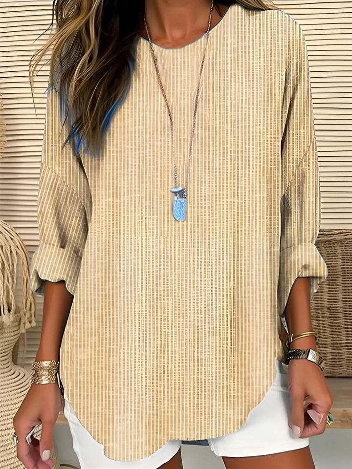 Chic striped long sleeve women's blouse with a relaxed fit & round neck. Effortless fashion for daily wear.