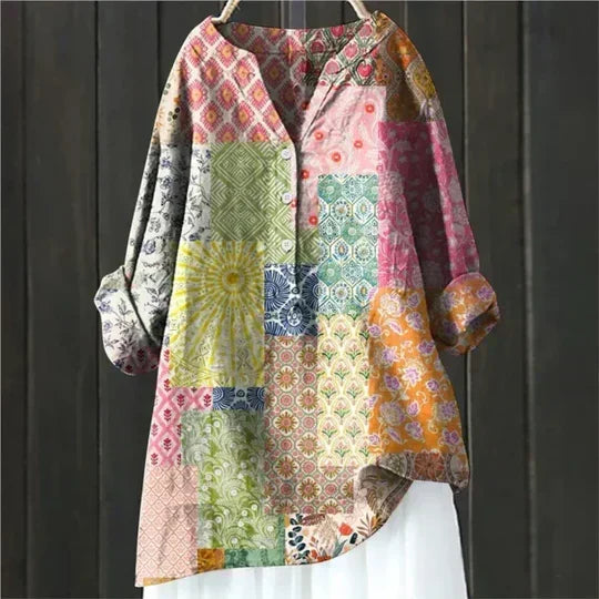 Stylish women's summer blouse with a relaxed fit, great for casual elegance & warm weather.