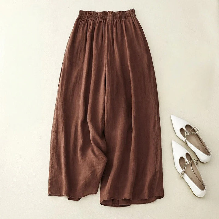 Women's relaxed fit trousers with loose waistband. Comfortable straight leg pants, versatile for everyday wear.