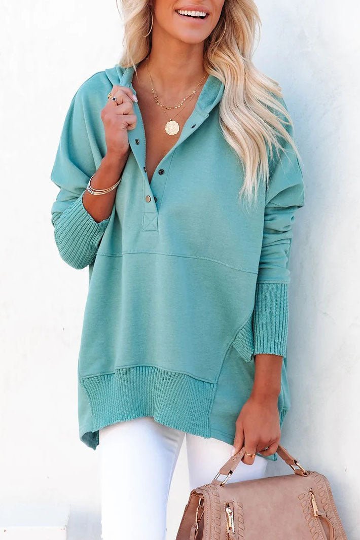 Stylish women's pullover tunic hoodie featuring snap buttons, perfect for casual, everyday wear.