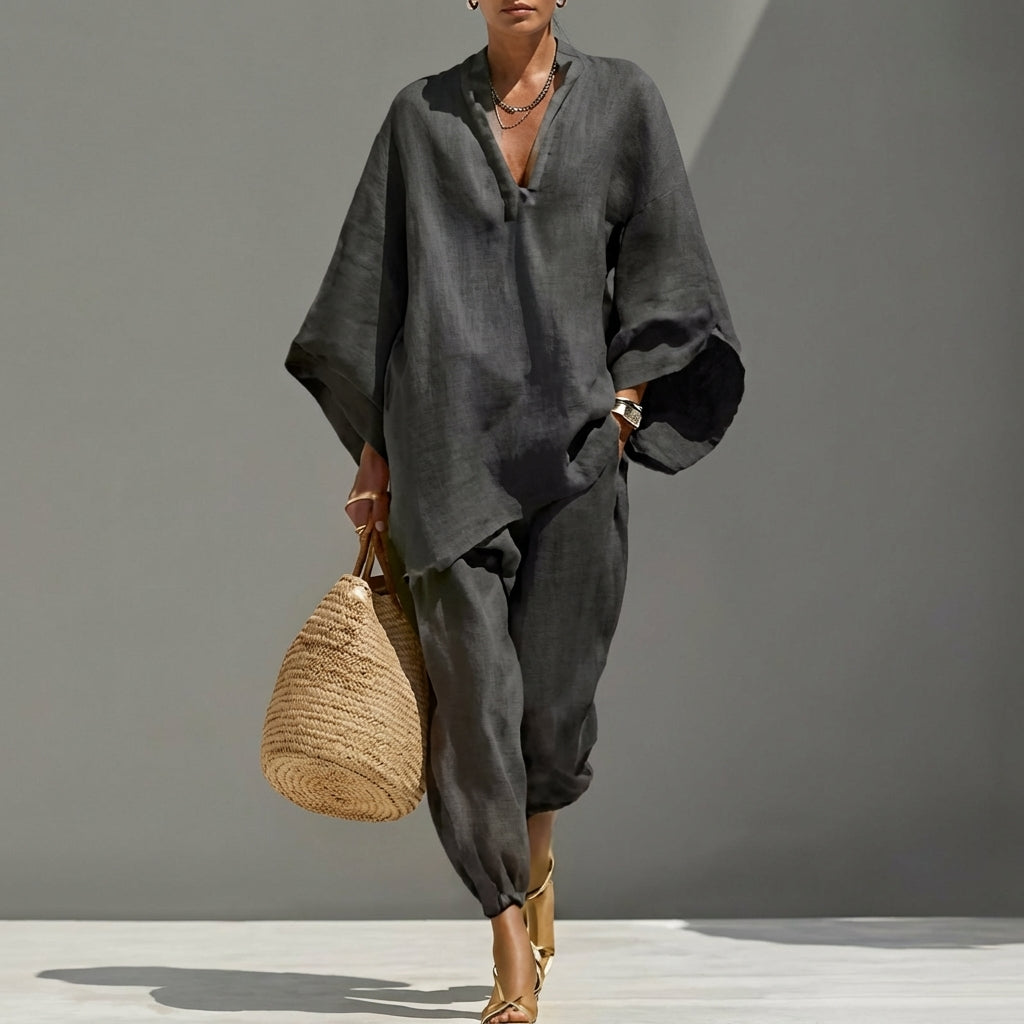 Stylish women's matching two-piece set with a loose tunic top & chic tapered pants. Vacation ready.