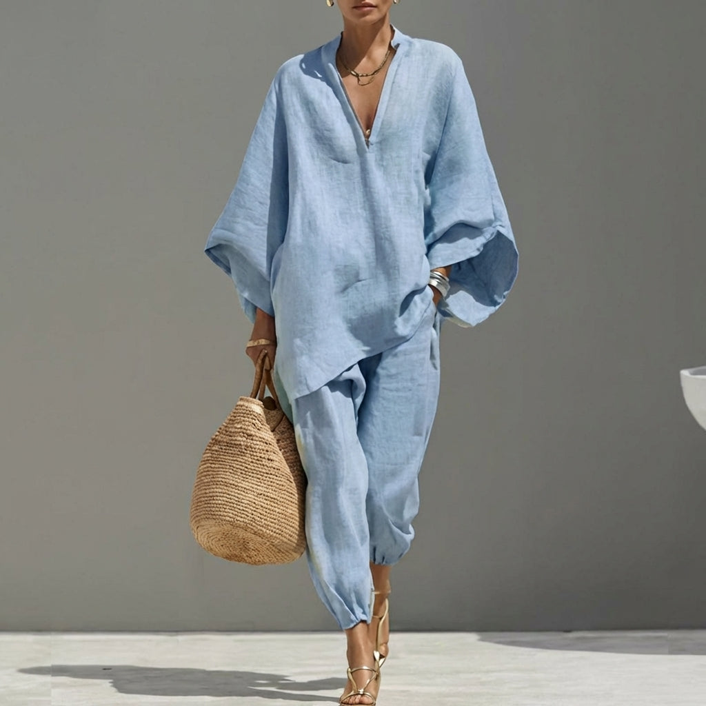 Comfortable women's two-piece set: relaxed tunic top & elegant tapered pants for casual wear.
