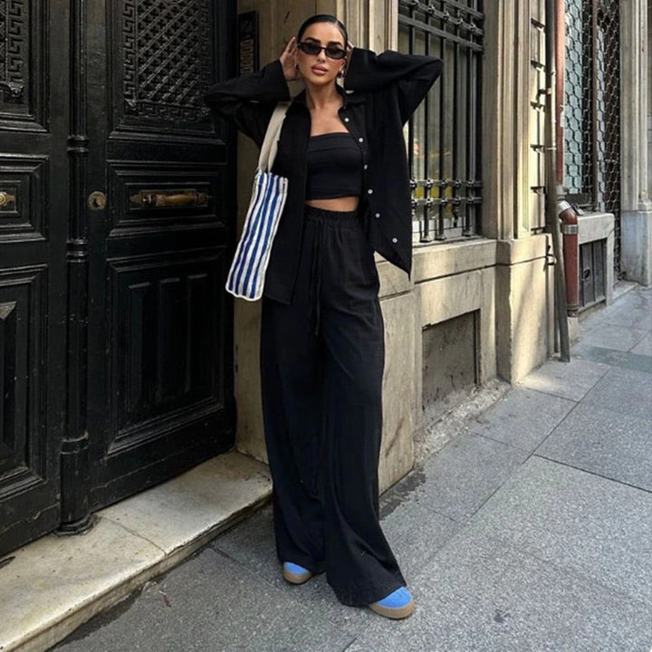 Chic women's relaxed fit two piece outfit set with a button-down shirt, wide-leg pants & drawstring waist.