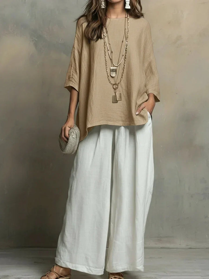 Comfortable women's relaxed fit two-piece matching set with loose top & wide-leg pants. Ideal for travel.