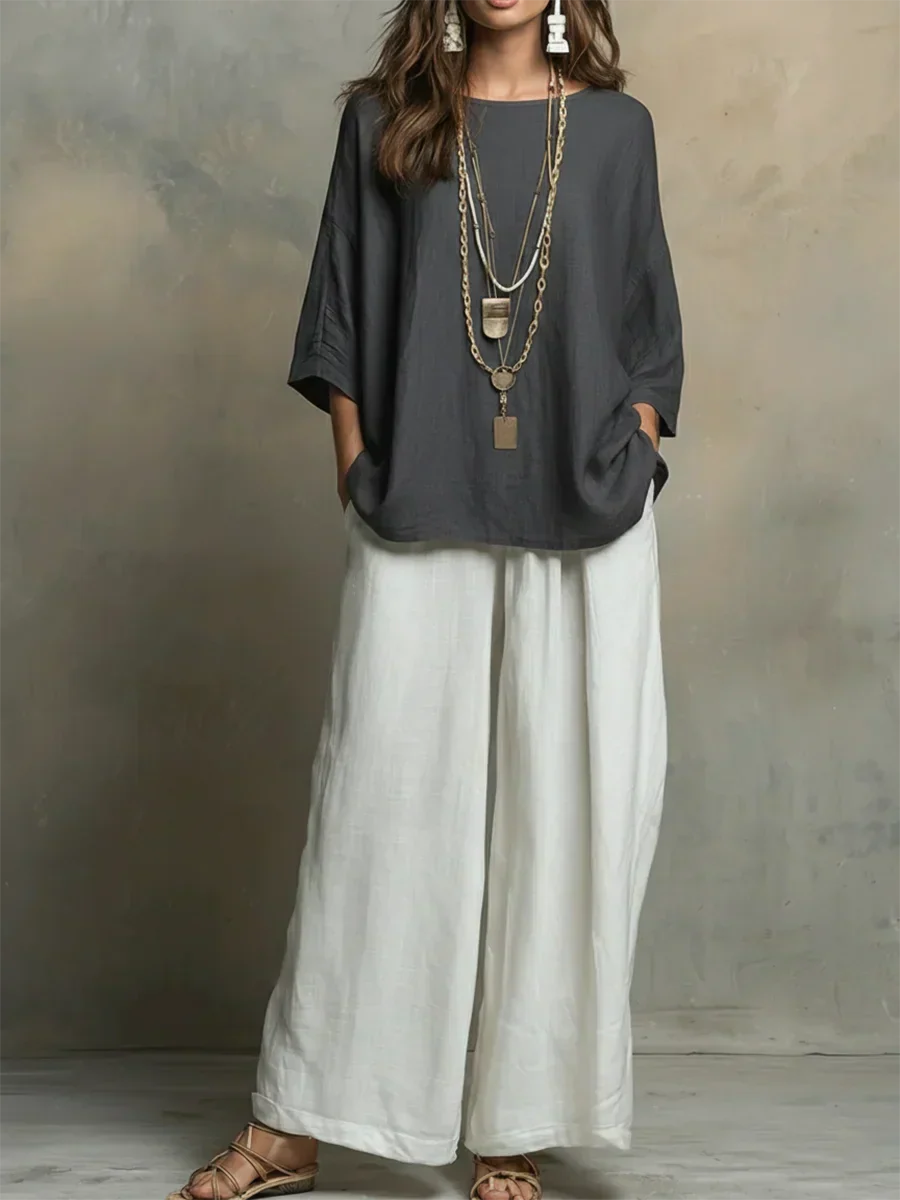 Women's relaxed fit two-piece shirt & wide-leg pants set for comfortable casual wear & summer travel.