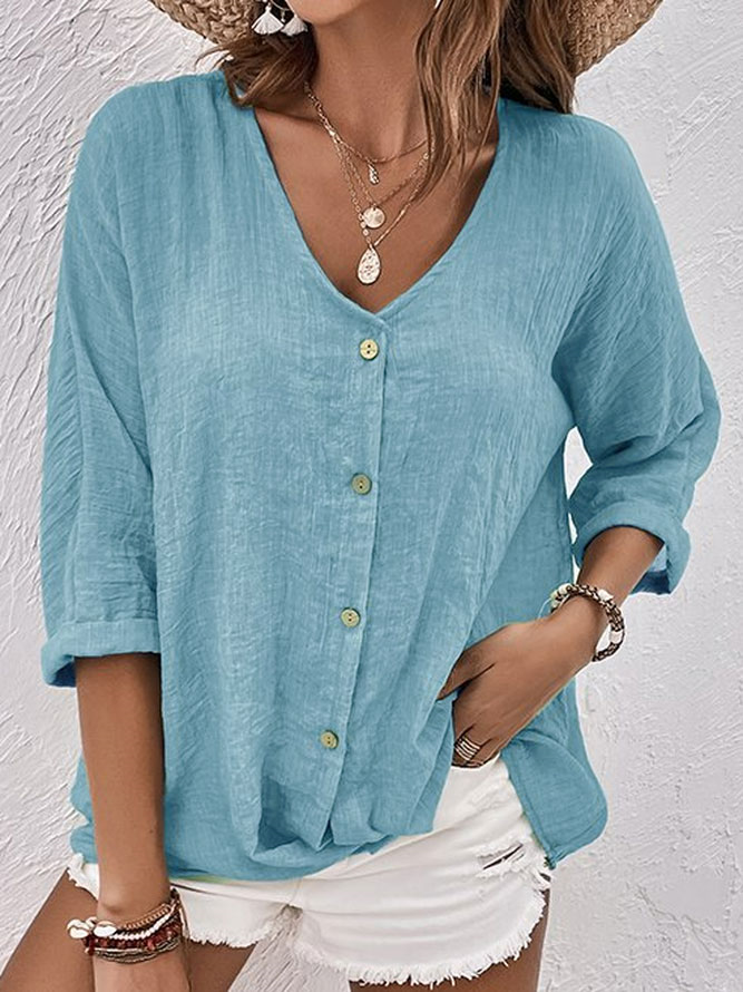 Women's relaxed fit V-neck button-down shirt, long sleeve, comfortable for casual everyday wear.