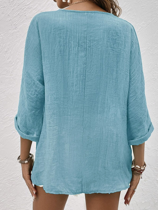 Lightweight women's V-neck button-down blouse, perfect for spring fashion or a summer casual top.