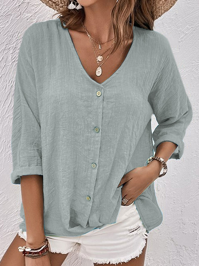 Comfortable women's V-neck button-down top, lightweight and breathable for casual outings.