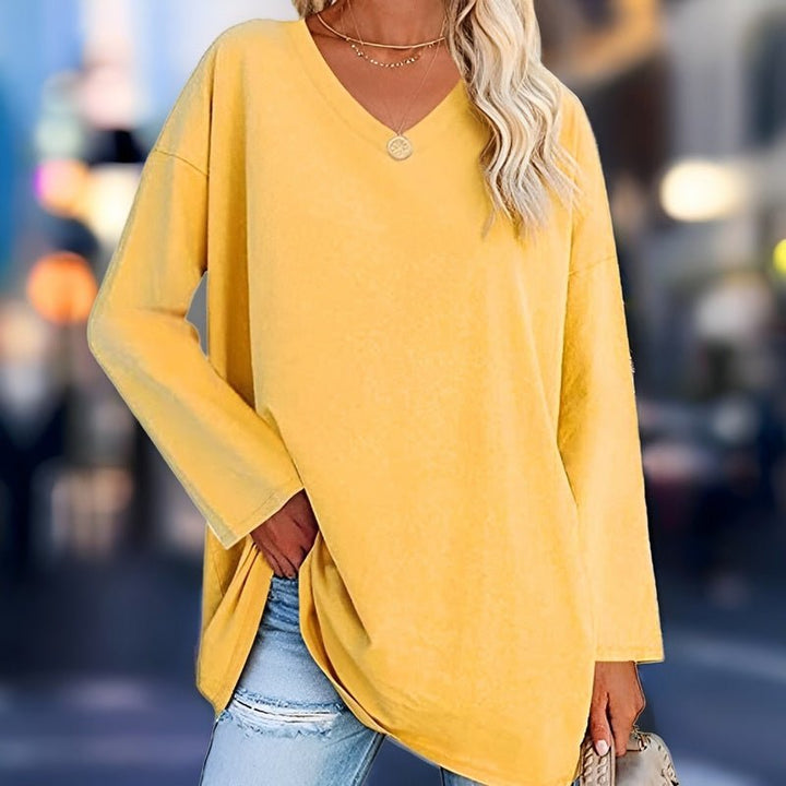 Women's relaxed fit V-neck long sleeve shirt for everyday casual comfort.