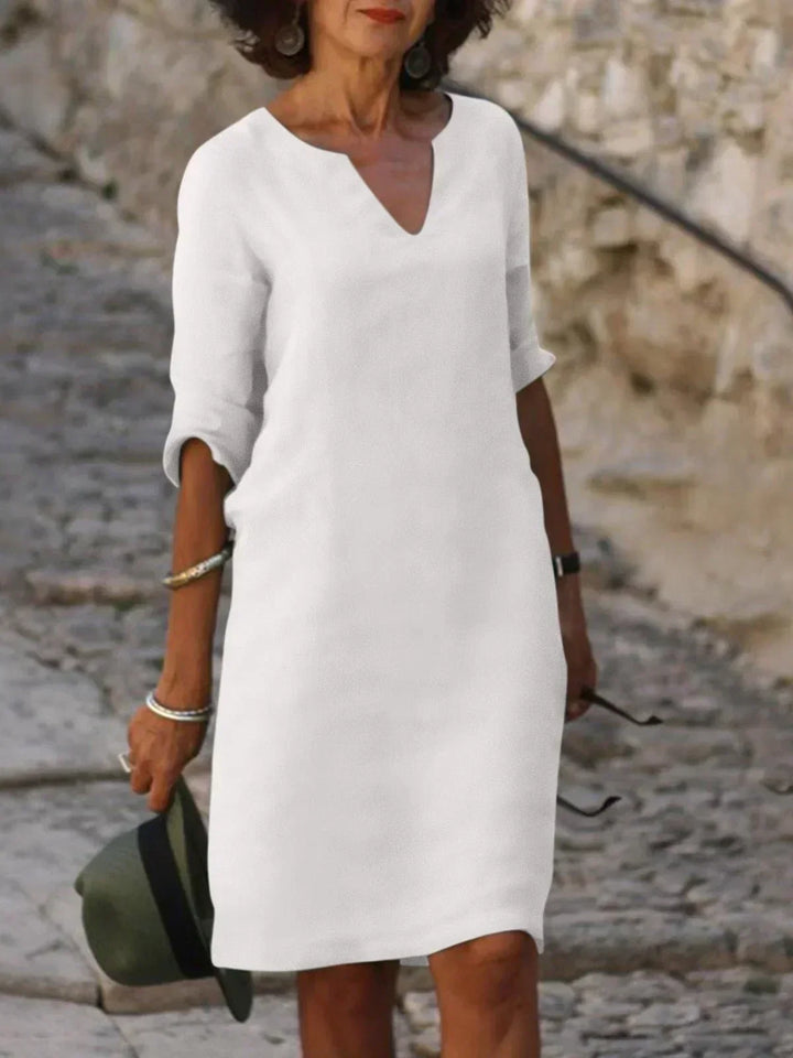 Women's relaxed V-neck 3/4 sleeve midi dress. Comfortable, stylish, and perfect for summer & versatile wear.