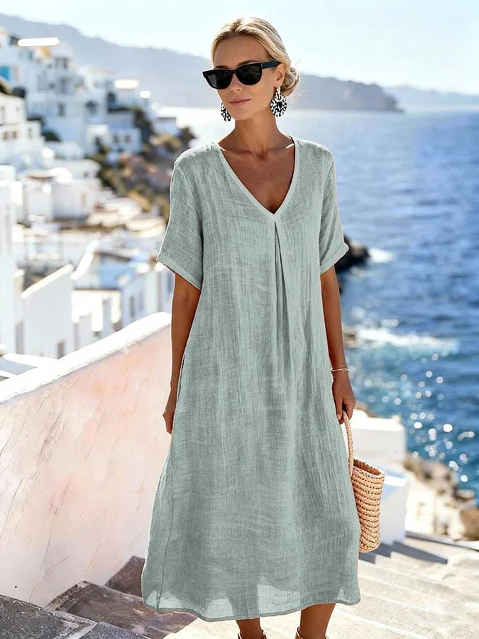 Beautifully flowing women's relaxed V-neck midi dress, short sleeves, perfect for warm weather.