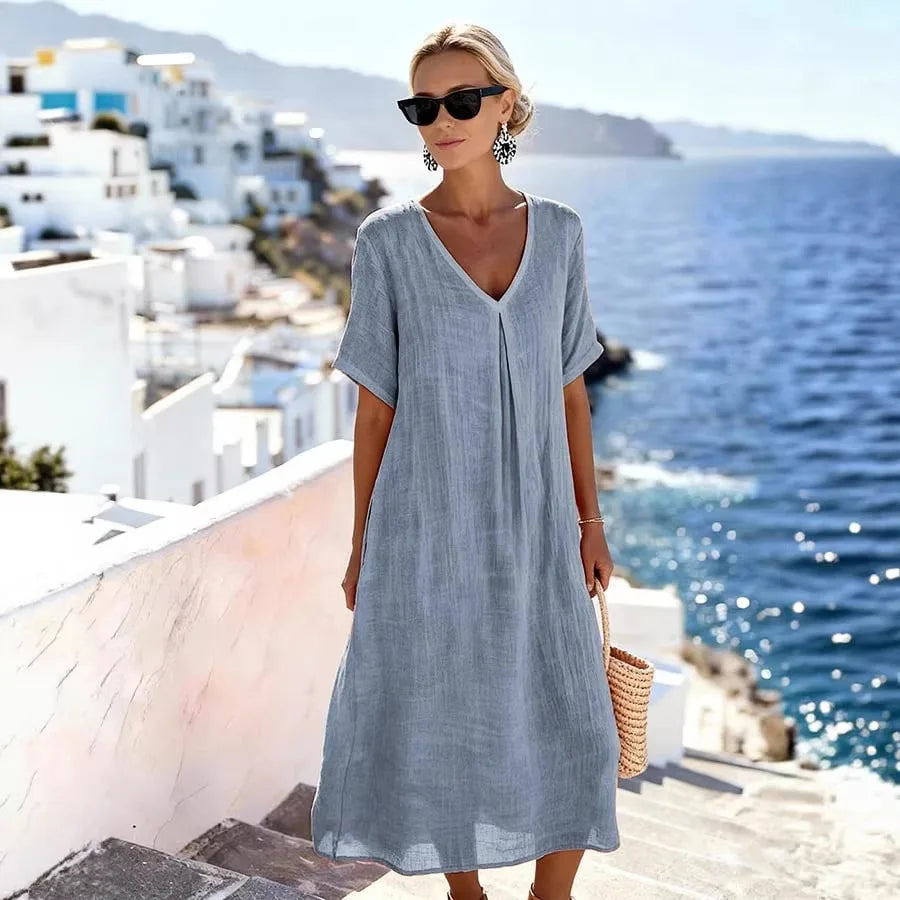 Comfortable women's relaxed V-neck midi dress, short sleeves, ideal for travel or everyday.