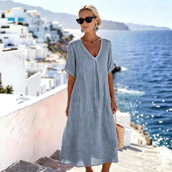 Comfortable women's relaxed V-neck midi dress, short sleeves, ideal for travel or everyday.