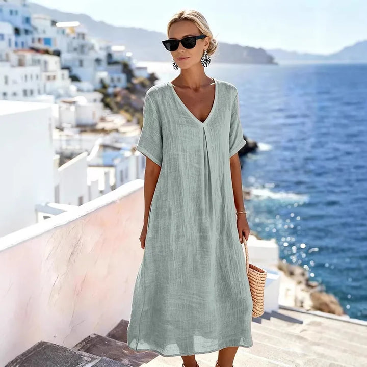Versatile women's V-neck midi dress, short sleeves, relaxed fit, great for beach or casual outings.