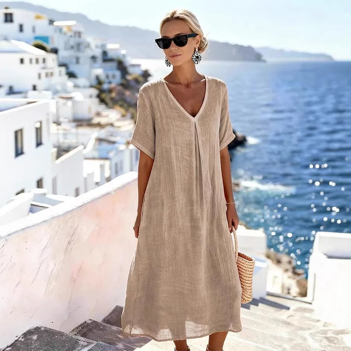 Easy-wear women's V-neck midi dress with short sleeves, relaxed flowing fit for warm weather.