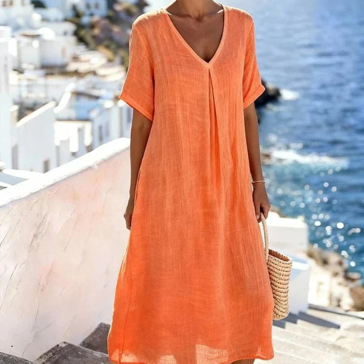 Chic women's relaxed fit V-neck midi dress, short sleeves, perfect for casual summer days.