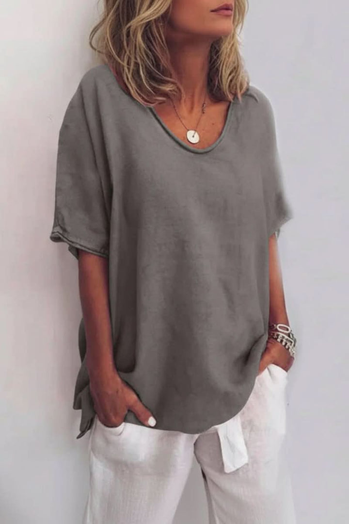 Stylish women's V-neck summer blouse, great for brunch outfits or a relaxed beach day.