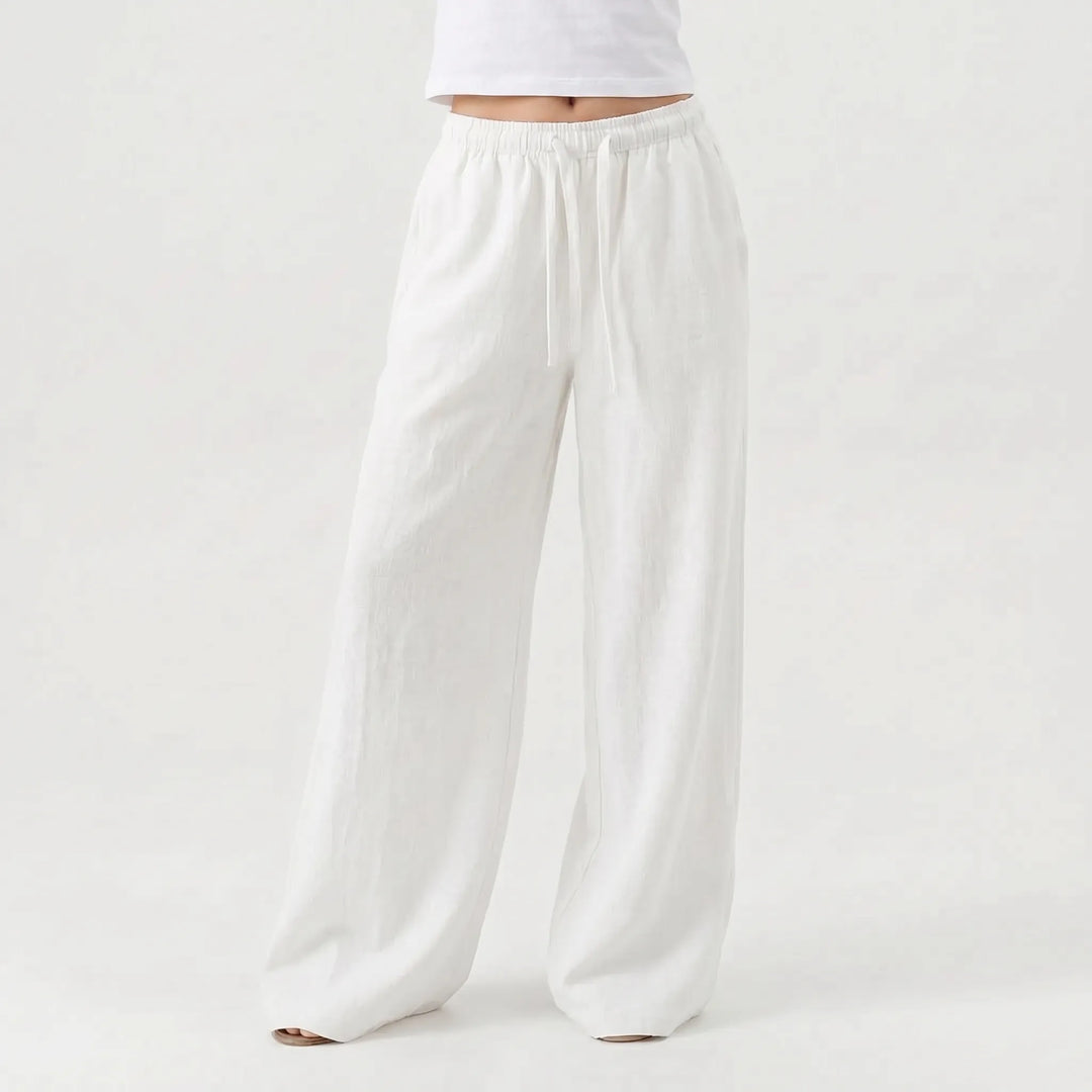 Stylish women's relaxed fit wide-leg trousers, high-waisted and full-length, great for comfortable everyday wear.