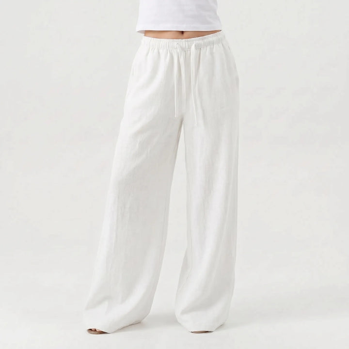 Stylish women's relaxed fit wide-leg trousers, high-waisted and full-length, great for comfortable everyday wear.