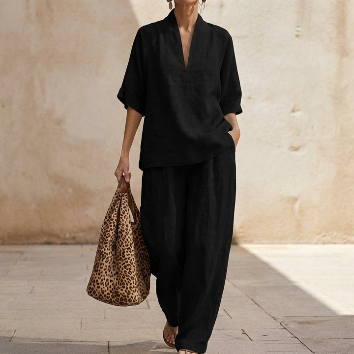 Matching women's V-neck top and wide-leg pants set. A relaxed fit, versatile style for any casual occasion.