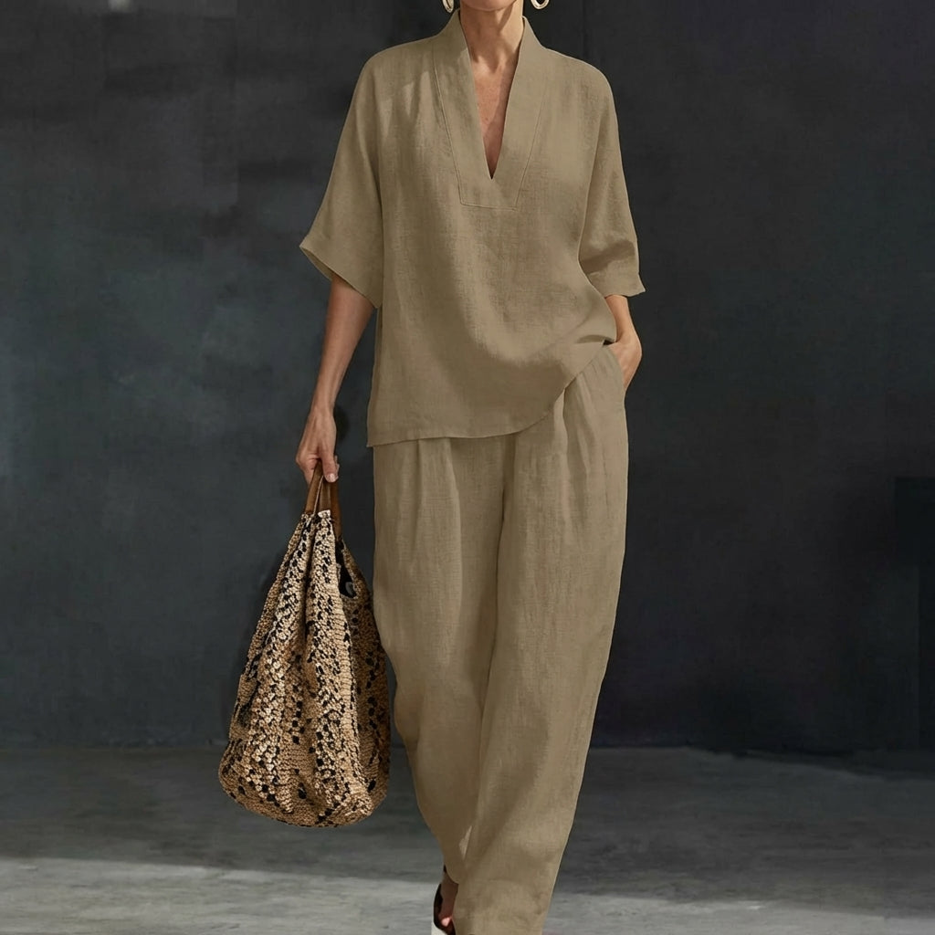 Women's fashionable two-piece set: relaxed V-neck top & wide-leg pants. Effortlessly stylish casual outfit.