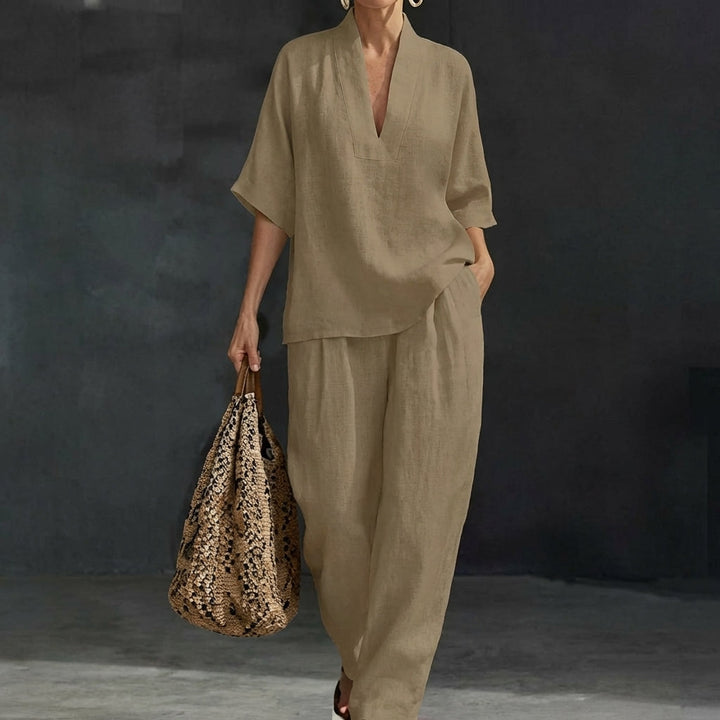 Women's fashionable two-piece set: relaxed V-neck top & wide-leg pants. Effortlessly stylish casual outfit.