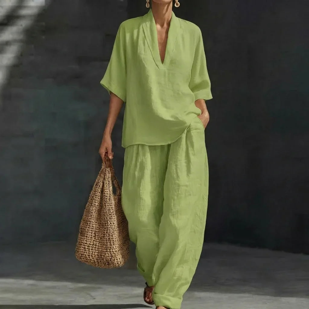 Complete women's fashion matching set with a relaxed V-neck top and comfy wide-leg pants. Versatile style.
