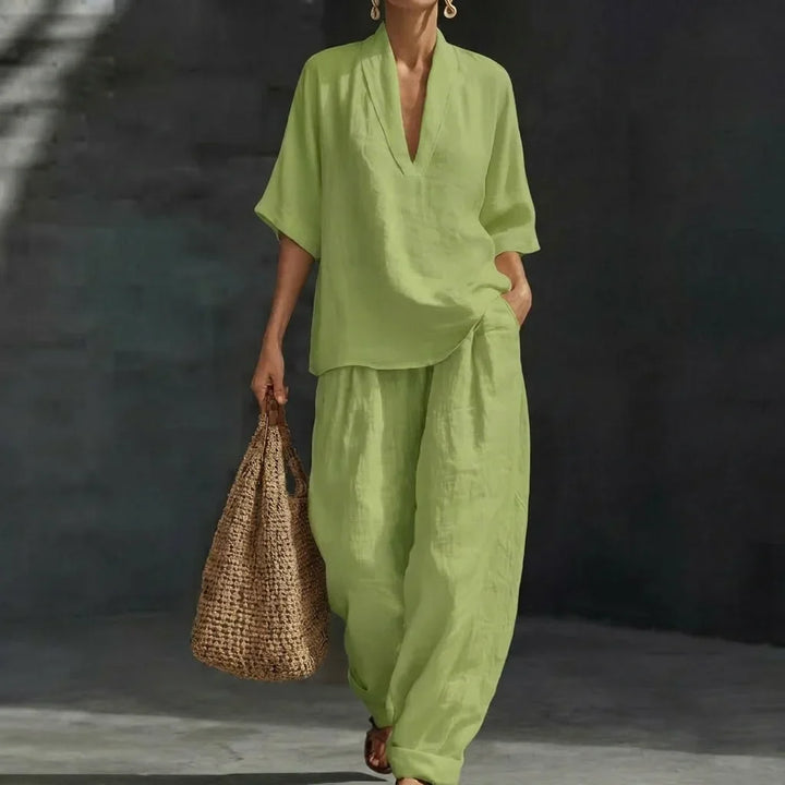 Complete women's fashion matching set with a relaxed V-neck top and comfy wide-leg pants. Versatile style.