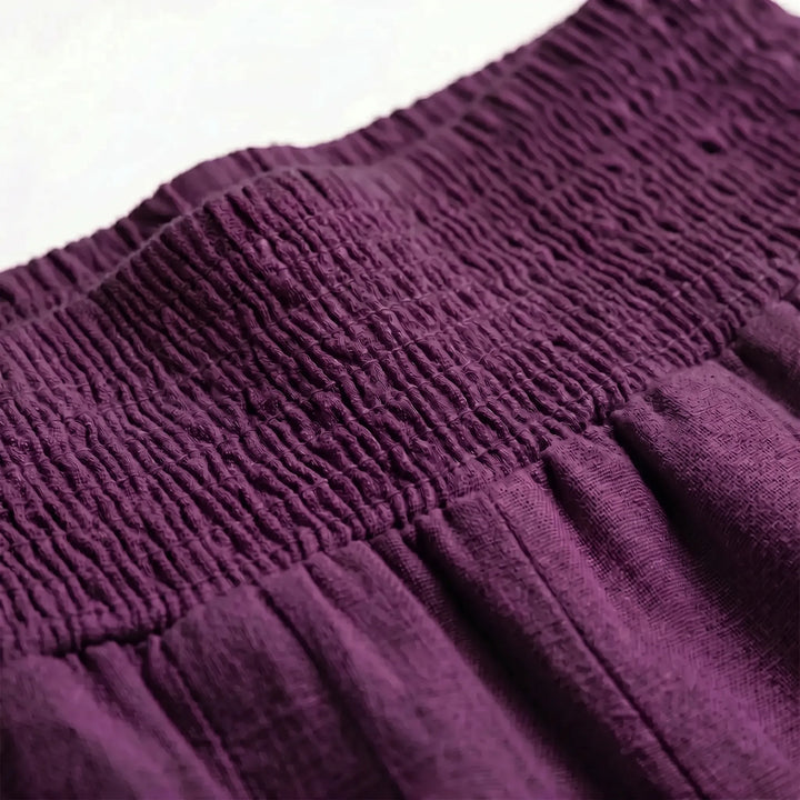 Effortless women's relaxed fit wide-leg pants with an adjustable waist, great for summer fashion.