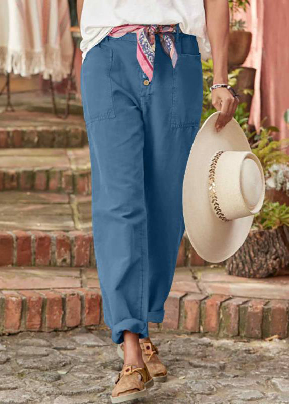 Model wearing women's relaxed wide leg trousers, showcasing their flowy movement and adjustable waist.