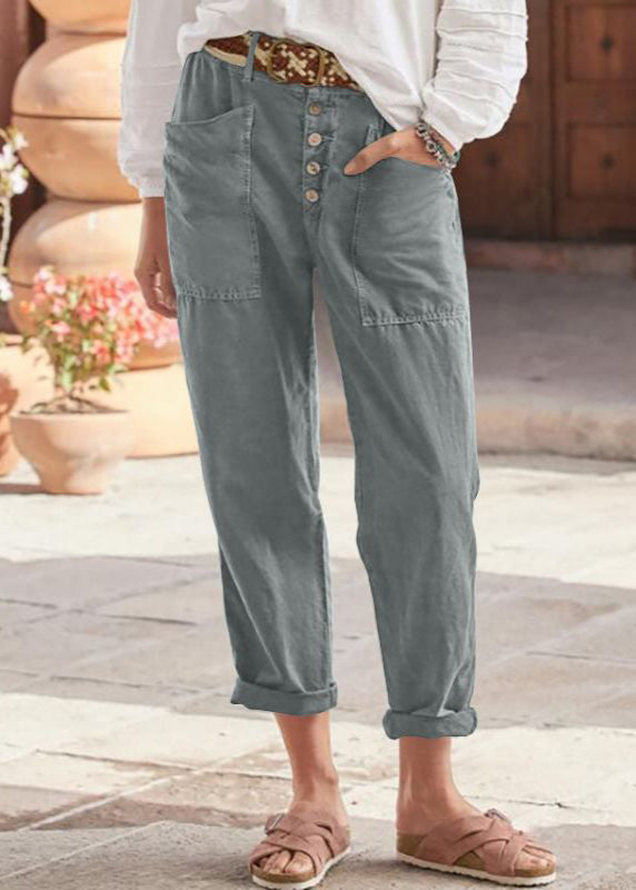 Close-up of the adjustable waist on women's relaxed wide leg trousers, emphasizing comfort & fit.