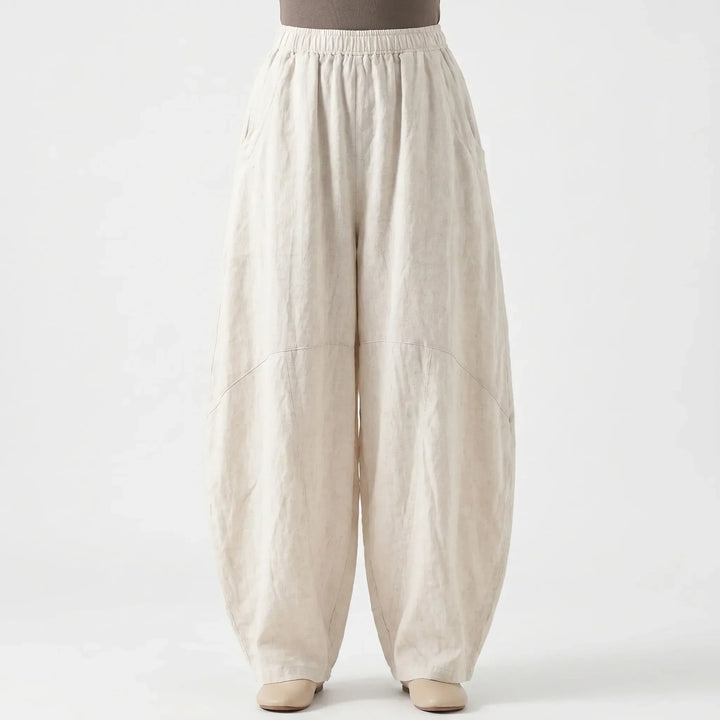 Stylish women's wide-leg trousers, relaxed fit with elastic waist, offering comfortable and chic spring/summer fashion.