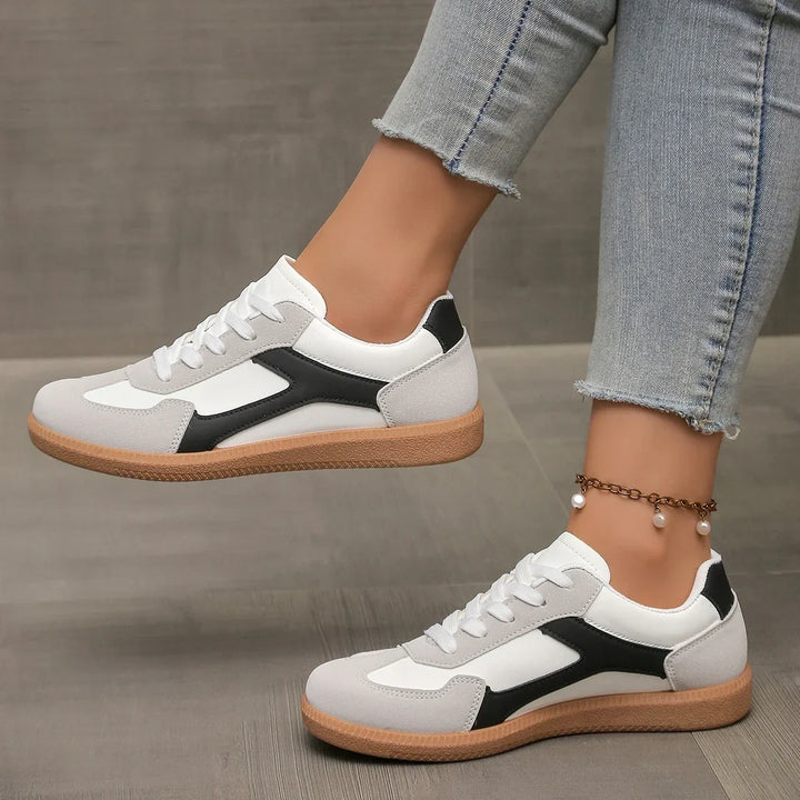 Low profile women's retro sneakers with a comfortable cushioned design and iconic gum sole. Great for casual wear.