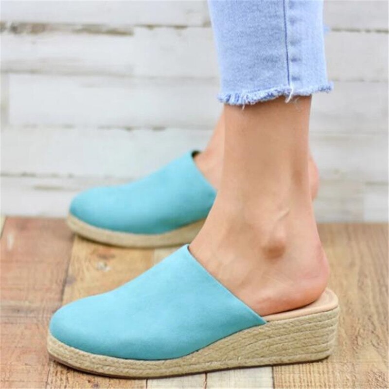Women's elegant wedge sandals, classic retro design for sophisticated summer fashion.