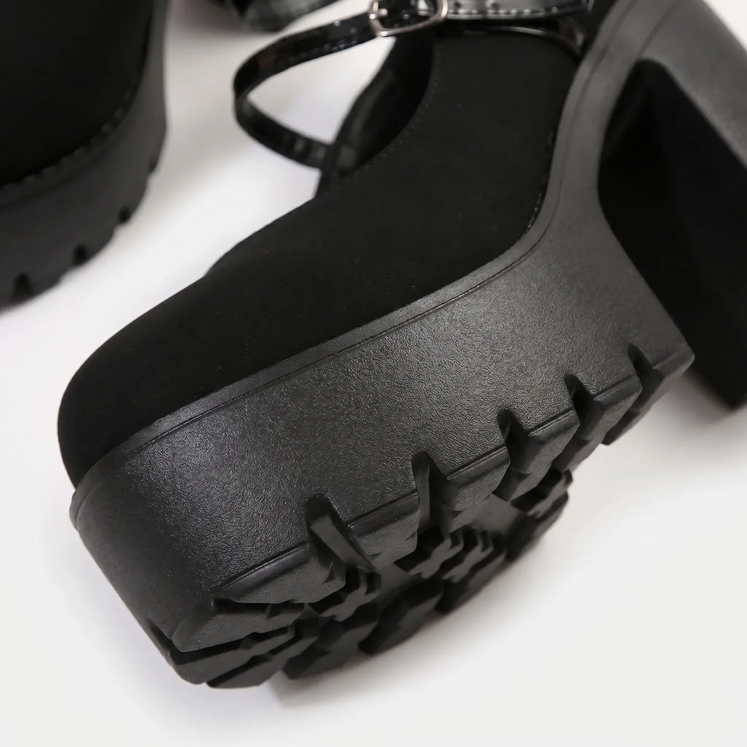 Chunky platform Mary Jane pumps for women, retro style. Adjustable strap and block heel suitable for formal or casual wear.