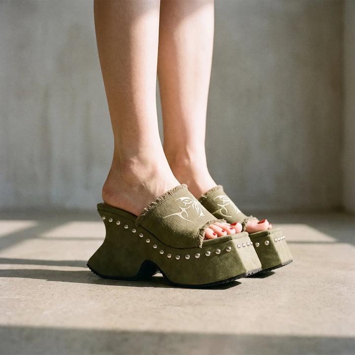 Women's retro chunky platform slip-on mules with a block heel for edgy summer fashion.