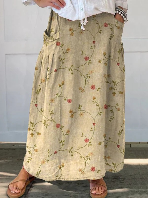 Women's retro floral A-line midi skirt with elastic waist & pockets. Perfect for vintage summer casual fashion.