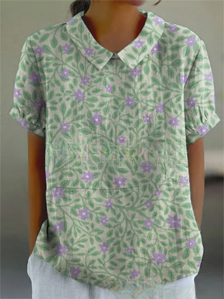 Collared women's retro floral blouse with intricate embroidery, a casual chic summer top.