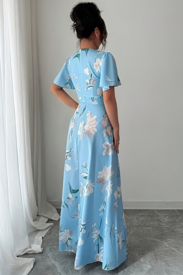 Summer women's retro floral midi dress, elegant pleated design with delicate ruffled sleeves.
