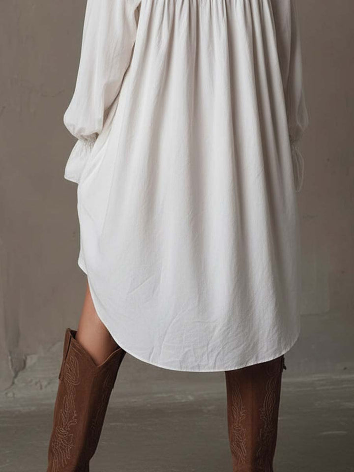 Elegant women's retro long sleeve mini dress with a distinctive irregular hem, suitable for stylish spring or fall fashion.
