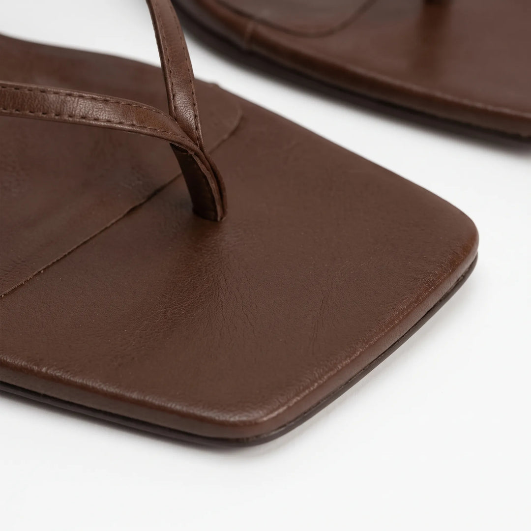 Fashionable women's square toe slingback sandals with kitten heels. Ideal summer footwear with adjustable strap.